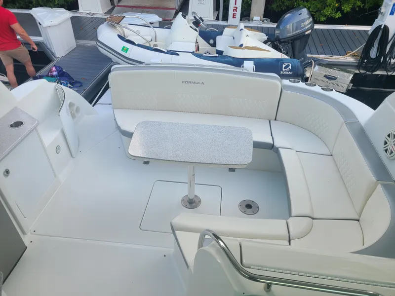 Slide: The Image of 2007 Formula 45 Yacht with spacious seating and table on deck. - 6