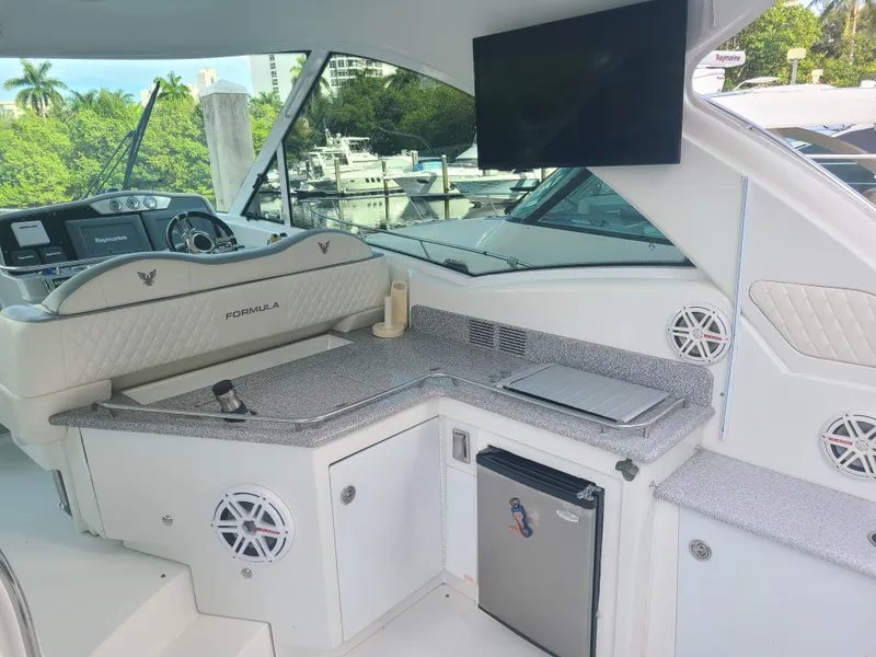 Slide: The Image of Interior of a 2007 Formula 45 Yacht with kitchenette and seating area. - 8