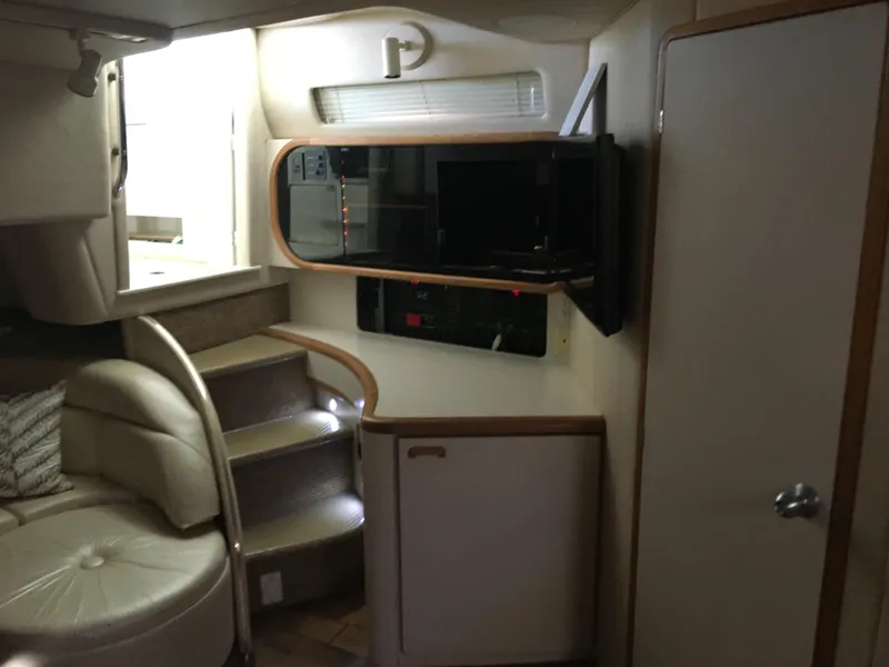 Slide: The Image of Interior of 1994 Sea Ray 500 Sundancer yacht with seating, stairs, and cabinetry. - 22