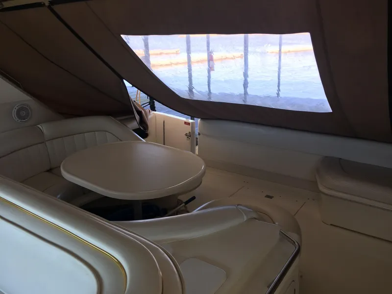 Slide: The Image of Interior of 1994 Sea Ray 500 Sundancer yacht with seating and table. - 25