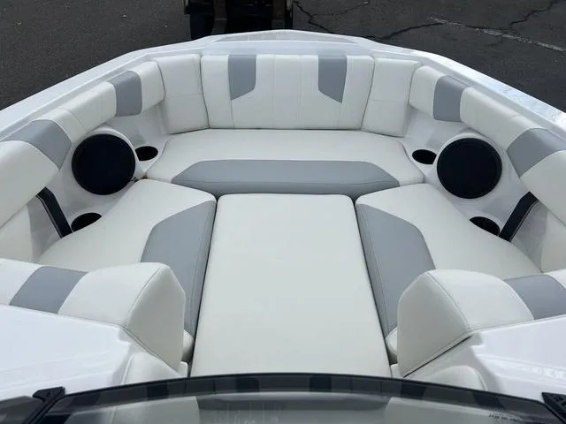 Slide: The Image of 2024 Malibu 21 LX-R boat interior with white and gray seating. - 10