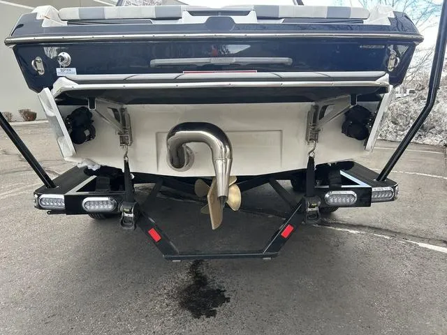 Slide: The Image of 2024 Malibu 21 LX-R boat stern with propeller and exhaust system. - 4