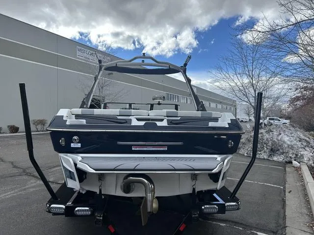 Slide: The Image of 2024 Malibu 21 LX-R boat rear view in parking lot. - 5