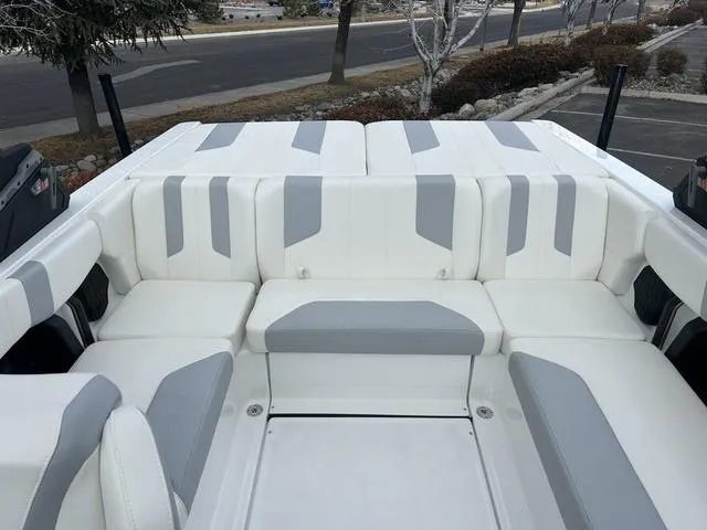 Slide: The Image of 2024 Malibu 21 LX-R boat with white and gray seating. - 7