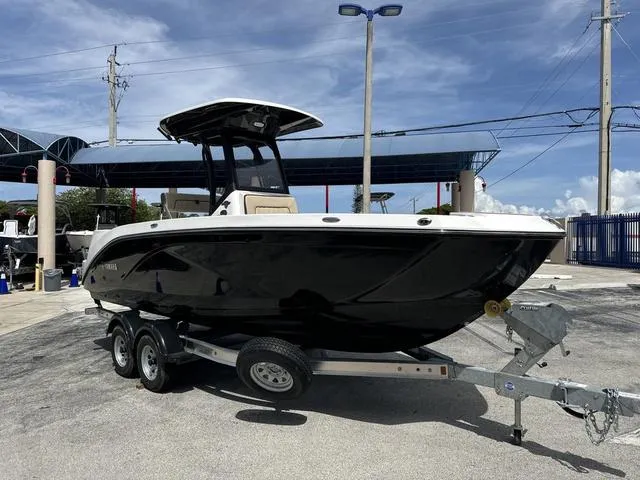 Slide: The Image of 2024 Yamaha Boats 222 FSH Sport E cockpit with steering wheel and control panel. - 7