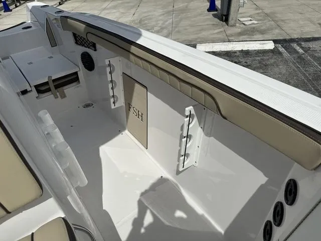 Slide: The Image of 2024 Yamaha Boats 222 FSH Sport E interior seating and deck area. - 20