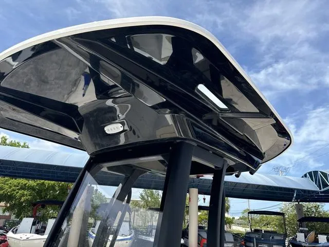 Slide: The Image of 2024 Yamaha Boats 222 FSH Sport E storage compartment with cushioned seats. - 11