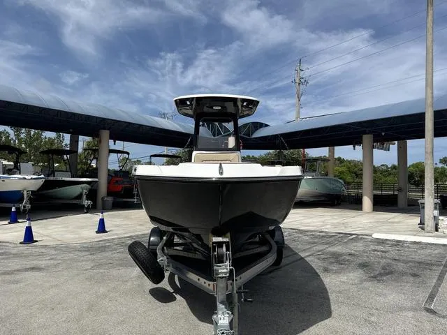 Slide: The Image of 2024 Yamaha Boats 222 FSH Sport E dashboard with steering wheel and control panel. - 8