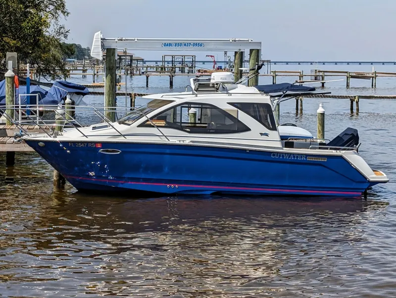 Slide: The Image of 2016 Cutwater 24 boat docked at a marina. - 1