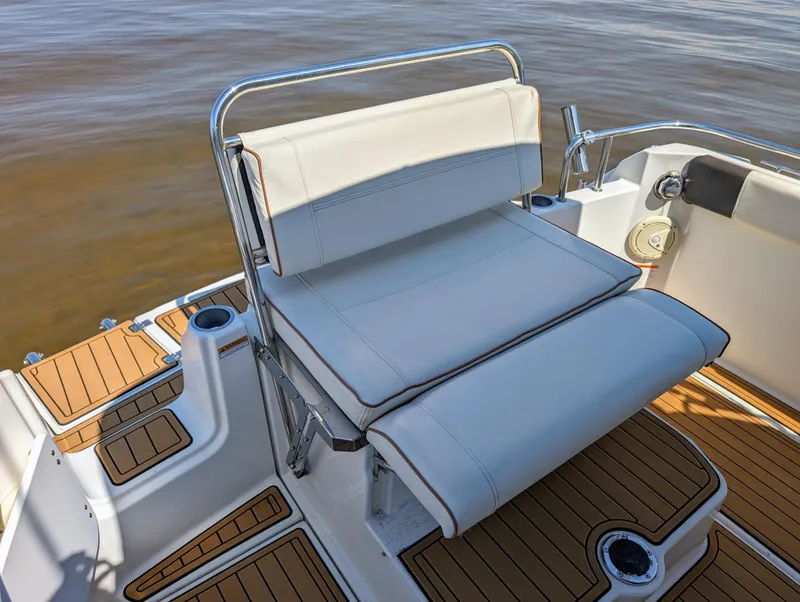 Slide: The Image of 2016 Cutwater 24 boat with cushioned seating and teak deck - 9