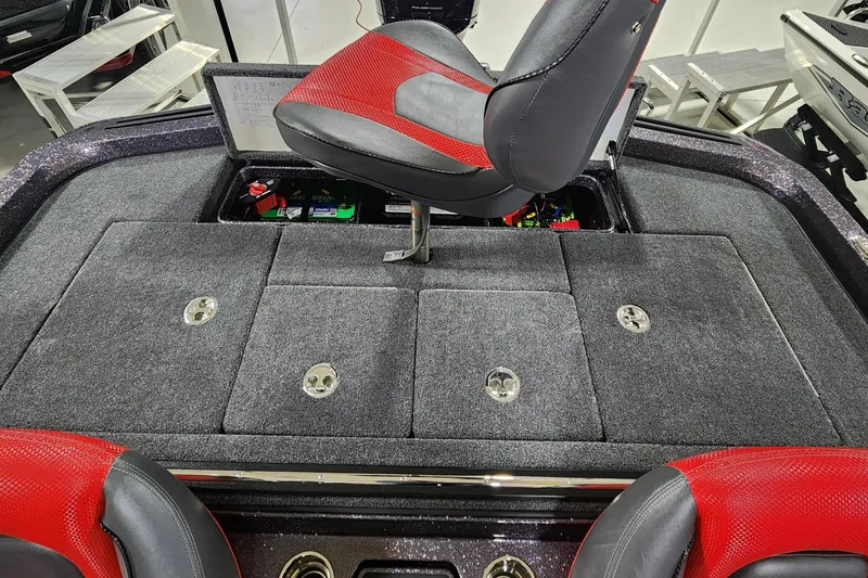 Slide: The Image of 2024 Ranger Z518 boat interior with red and black seating and storage compartments. - 10