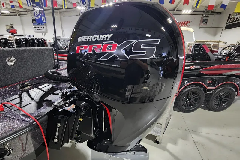 Slide: The Image of 2024 Ranger Z518 boat with Mercury Pro XS outboard motor in showroom. - 14