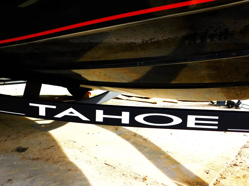 Slide: The Image of 2024 Tahoe T16 boat trailer with bold branding. - 18