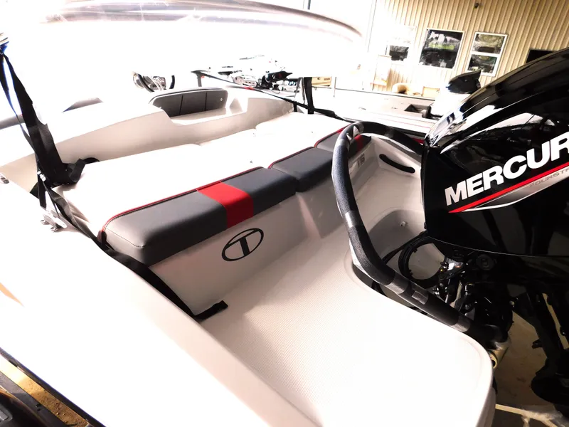 Slide: The Image of 2024 Tahoe T16 boat interior with Mercury engine, featuring sleek seating and modern design. - 21
