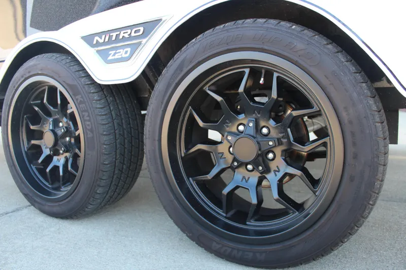 Slide: The Image of 2024 Nitro Z20 trailer with black alloy wheels and Kenda tires. - 10
