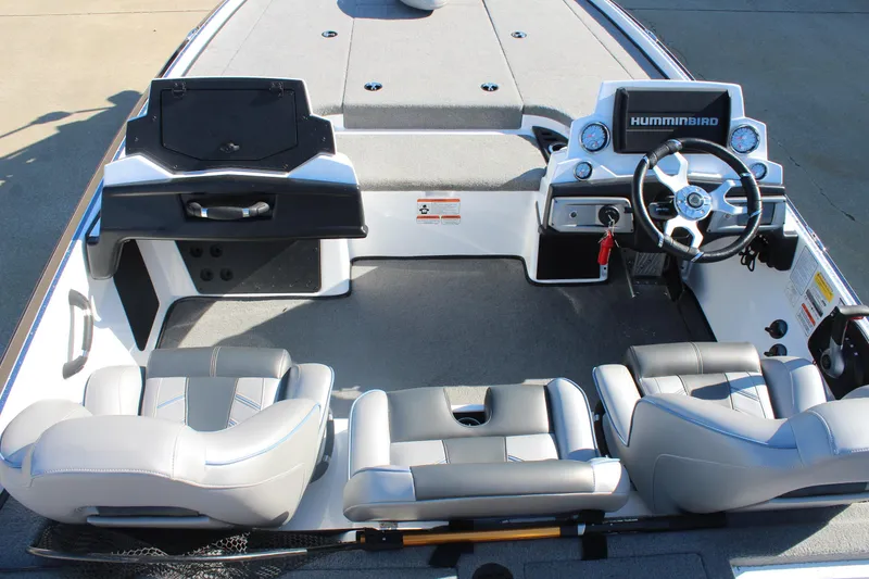 Slide: The Image of 2024 Nitro Z20 boat interior with steering wheel, seats, and Humminbird electronics. - 15