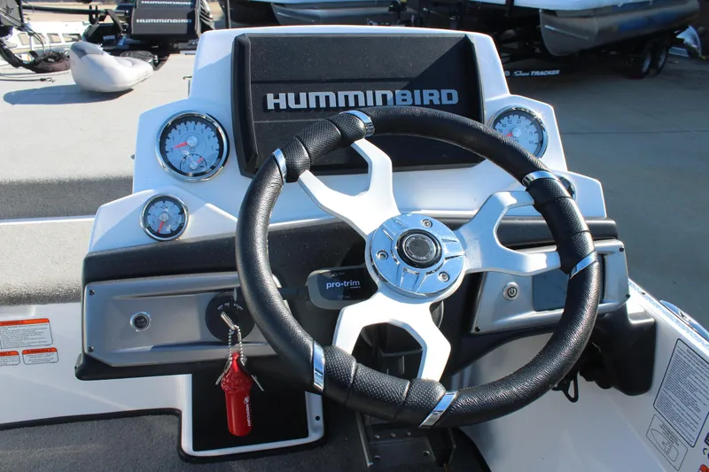 Slide: The Image of 2024 Nitro Z20 boat dashboard with steering wheel and Humminbird electronics. - 18