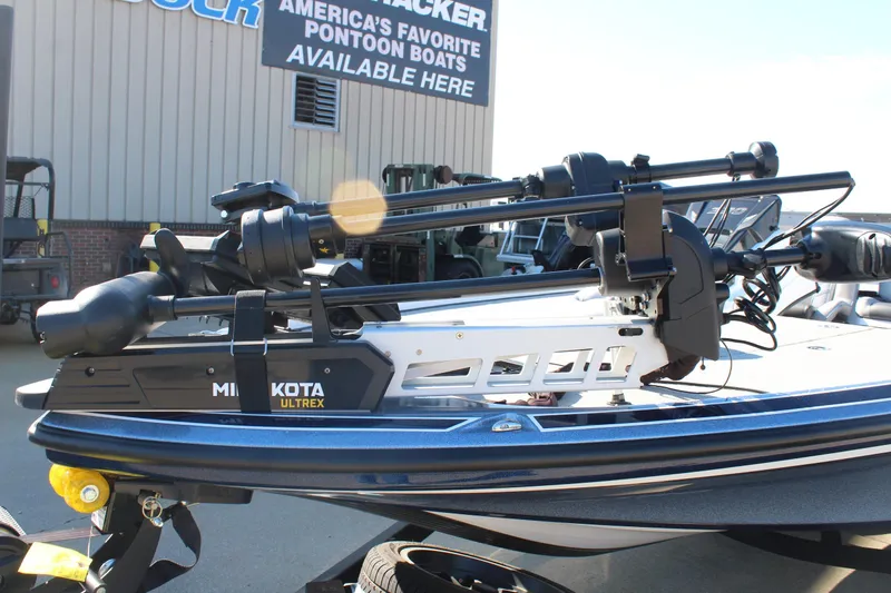 Slide: The Image of 2024 Nitro Z20 boat with Minn Kota Ultrex trolling motor, displayed outdoors. - 25