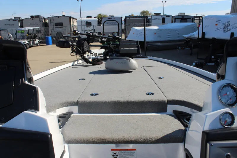 Slide: The Image of 2024 Nitro Z20 boat deck with fishing equipment, gauges, and storage compartments. - 29