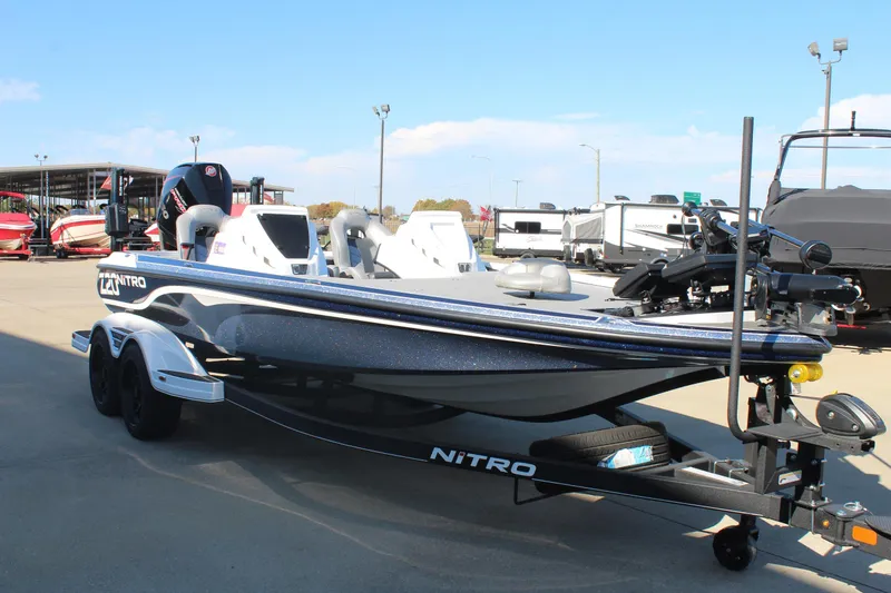 Slide: The Image of 2024 Nitro Z20 boat on trailer in outdoor showroom. - 5