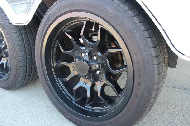 Slide: The Image of 2024 Nitro Z20 black alloy wheel and tire on concrete surface. - 9