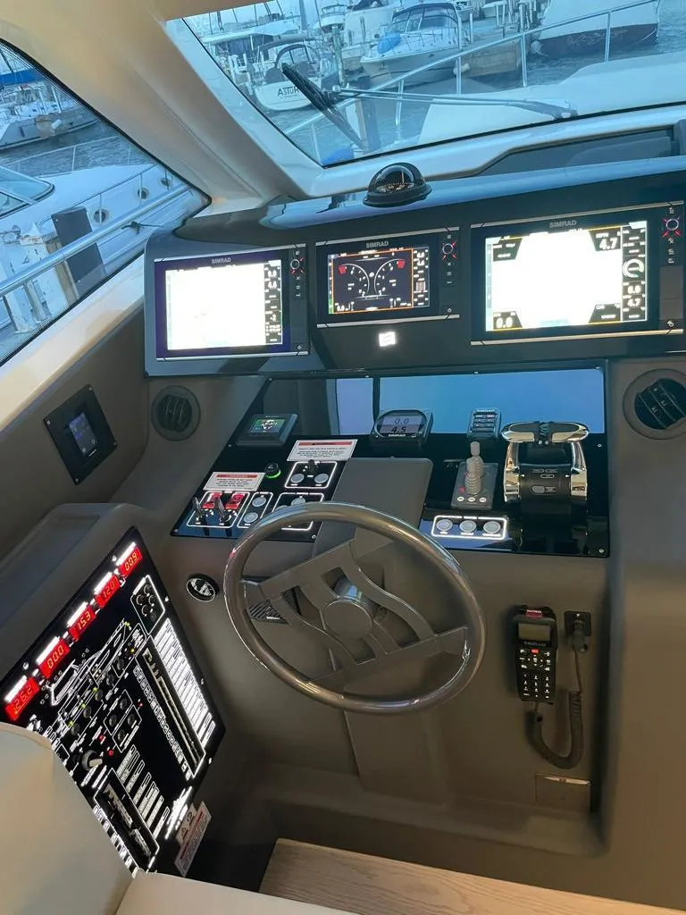 Slide: The Image of Cockpit of 2016 Ferretti Yachts 550 with advanced navigation systems. - 9