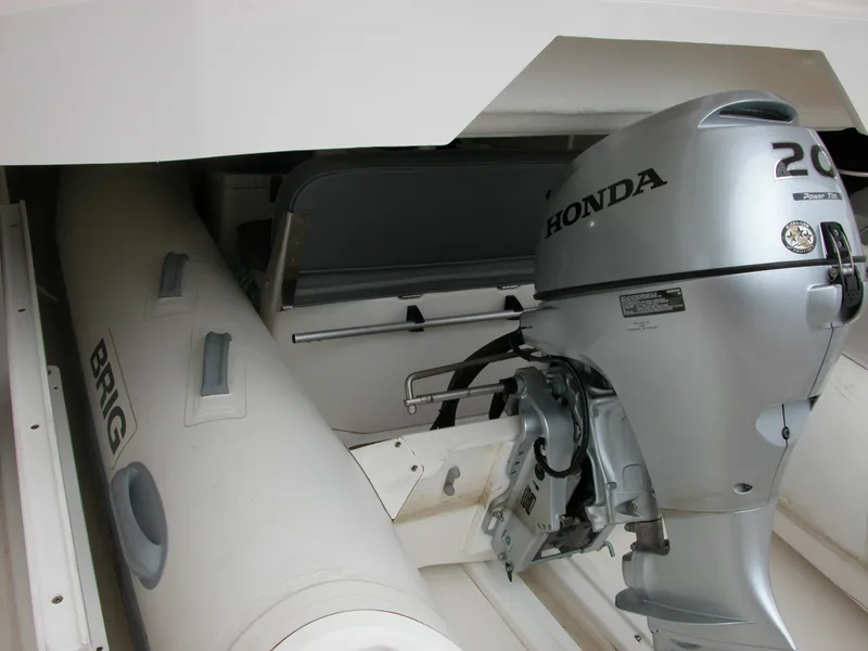 Slide: The Image of 2022 Riviera Sport Yacht 5400 Platinum Edition with Honda outboard motor and Brig inflatable boat. - 27