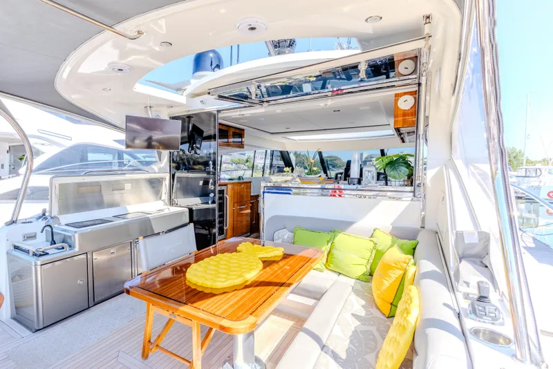 Slide: The Image of Luxurious interior of 2022 Riviera Sport Yacht 5400 Platinum Edition with modern amenities and stylish decor. - 32