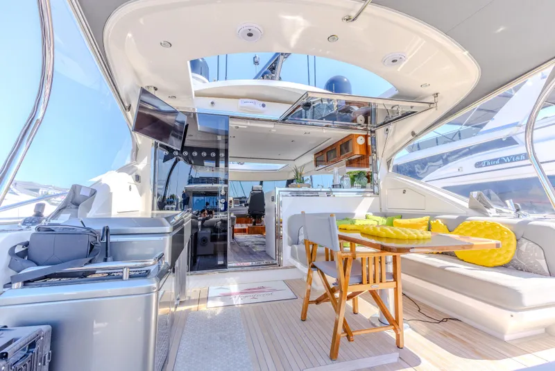 Slide: The Image of Luxurious 2022 Riviera Sport Yacht 5400 Platinum Edition interior with modern seating and decor. - 35