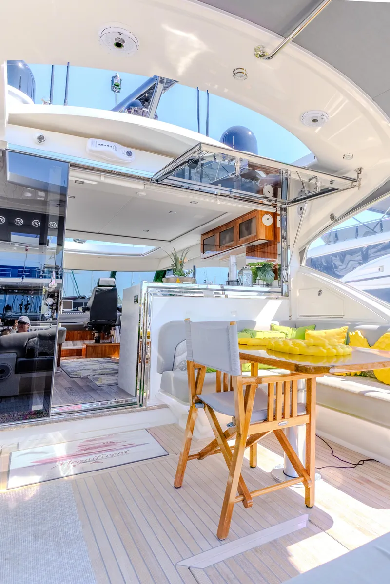 Slide: The Image of 2022 Riviera Sport Yacht 5400 Platinum Edition, luxurious interior with modern design and outdoor seating. - 36