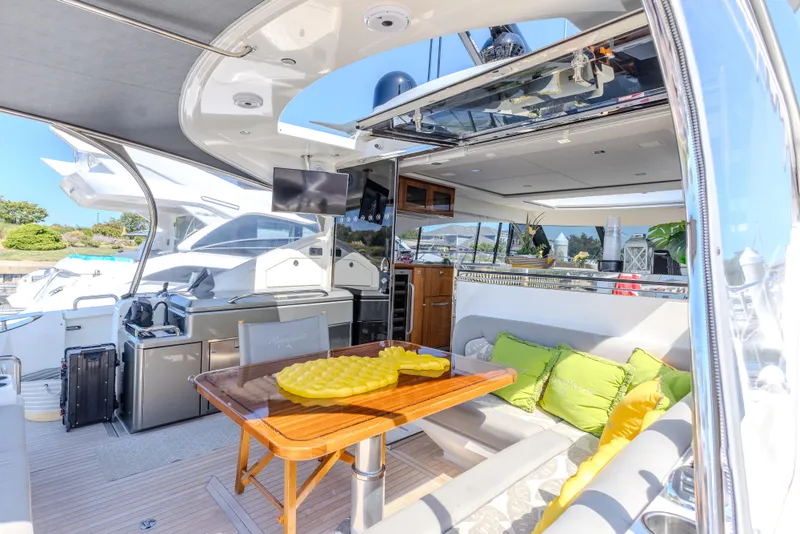 Slide: The Image of Luxurious 2022 Riviera Sport Yacht 5400 Platinum Edition interior with modern amenities and stylish seating. - 39