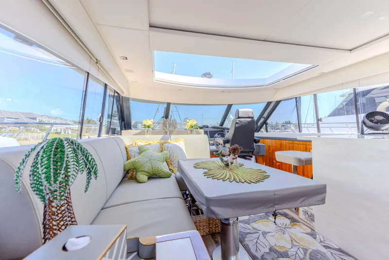 Slide: The Image of Luxurious interior of 2022 Riviera Sport Yacht 5400 Platinum Edition with elegant seating and decor. - 43