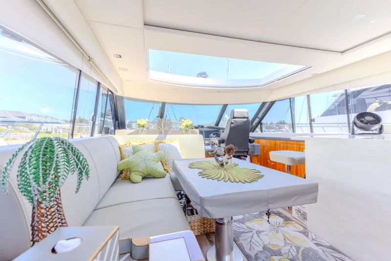 Slide: The Image of Luxurious interior of 2022 Riviera Sport Yacht 5400 Platinum Edition with elegant decor and panoramic windows. - 44