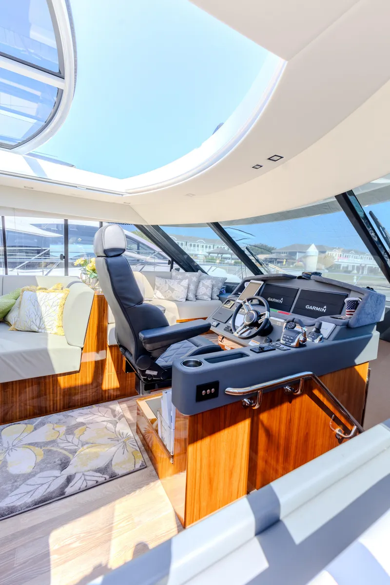 Slide: The Image of Luxurious interior of 2022 Riviera Sport Yacht 5400 Platinum Edition with modern helm and seating. - 45