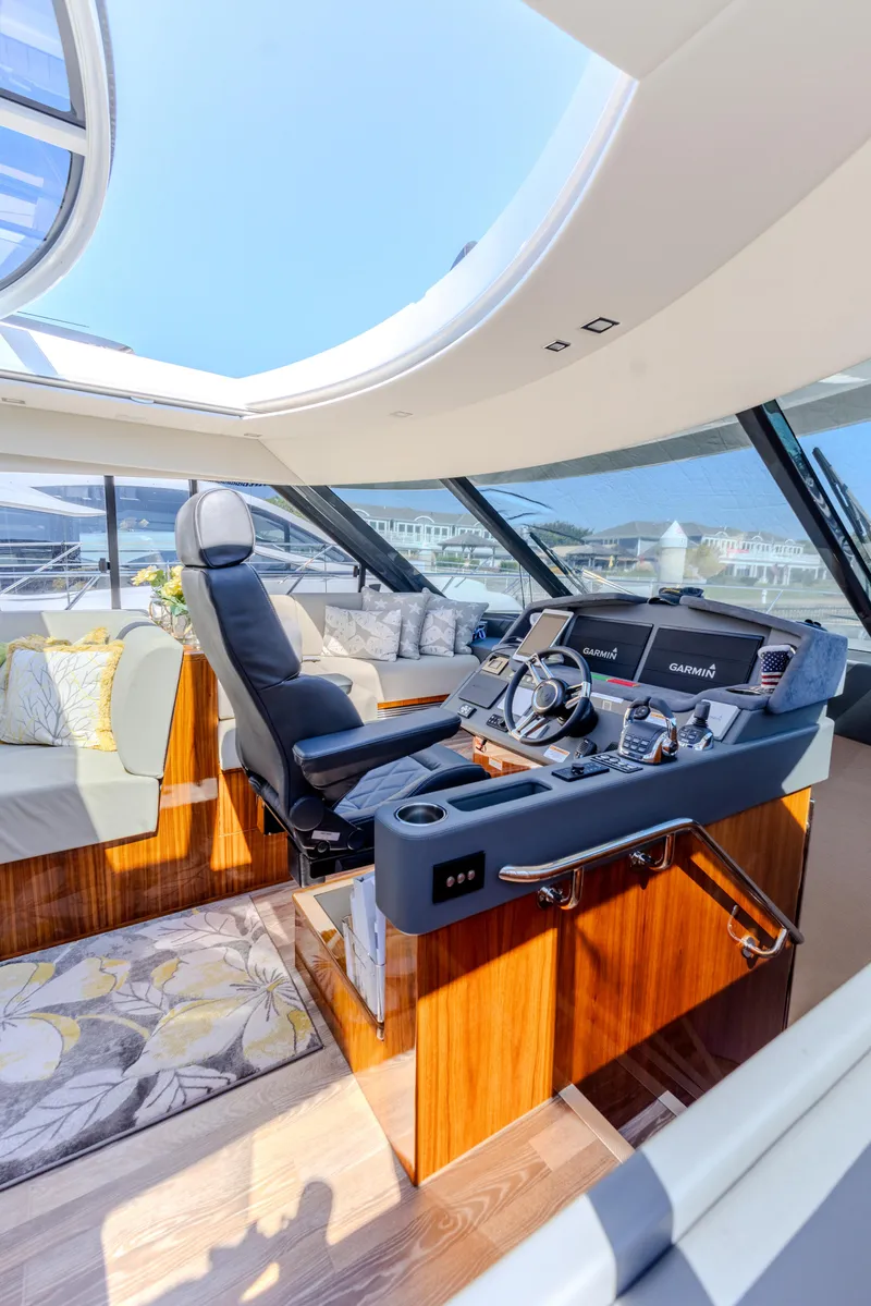 Slide: The Image of Luxurious interior of 2022 Riviera Sport Yacht 5400 Platinum Edition with modern helm and seating. - 46