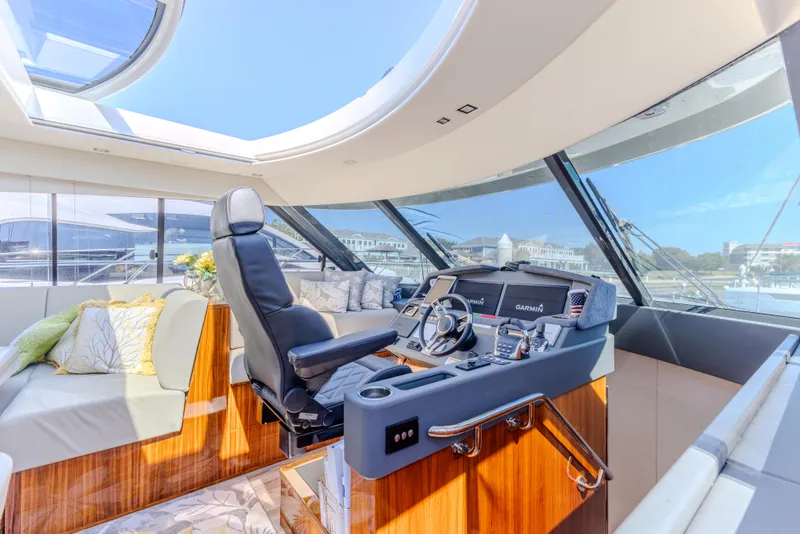 Slide: The Image of Luxurious interior of 2022 Riviera Sport Yacht 5400 Platinum Edition with modern helm and seating. - 47