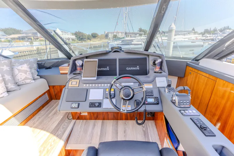 Slide: The Image of Cockpit of 2022 Riviera Sport Yacht 5400 Platinum Edition with Garmin navigation system. - 49