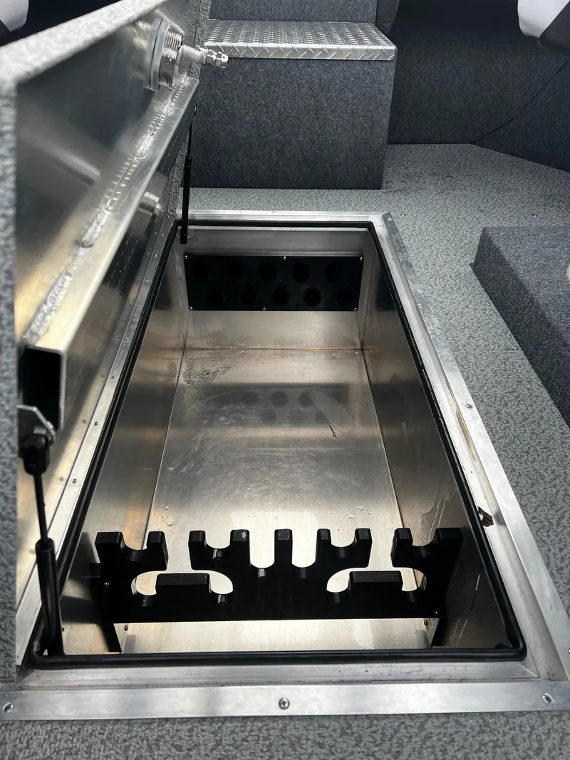 Slide: The Image of 2024 Thunder Jet 21 Chinook OS storage compartment with open lid. - 13