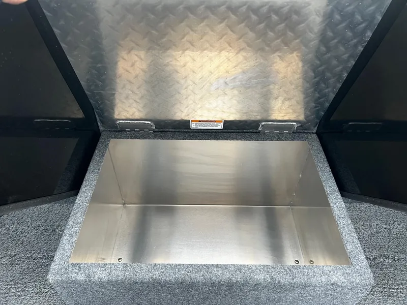 Slide: The Image of Open storage compartment in 2024 Thunder Jet 21 Chinook OS boat. - 14