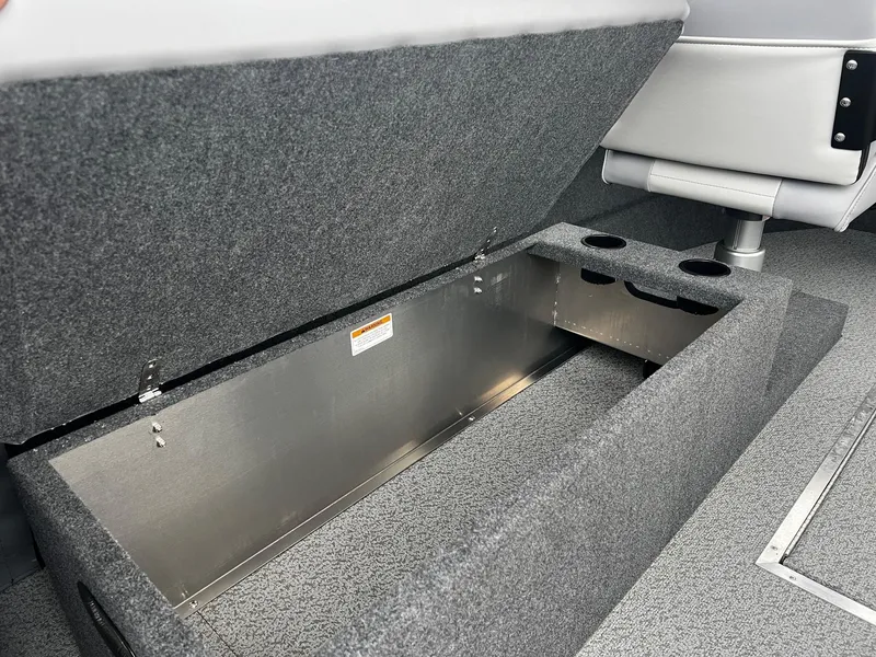 Slide: The Image of 2024 Thunder Jet 21 Chinook OS boat storage compartment with cup holders. - 16