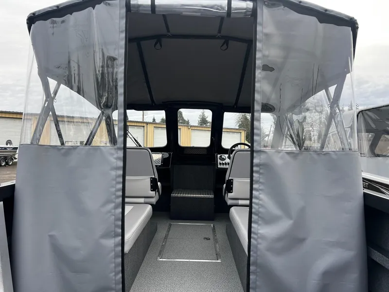 Slide: The Image of 2024 Thunder Jet 21 Chinook OS boat interior with seating and canopy. - 17
