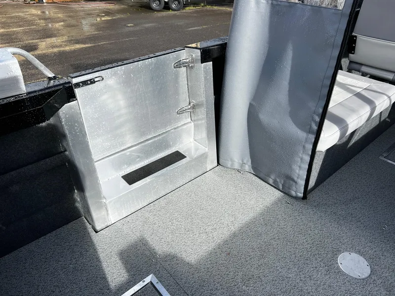 Slide: The Image of 2024 Thunder Jet 21 Chinook OS boat interior with aluminum storage compartment and seating. - 20