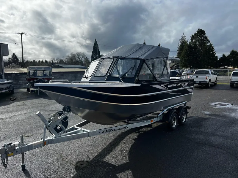 Slide: The Image of 2024 Thunder Jet 21 Chinook OS boat on a trailer in a parking lot. - 6