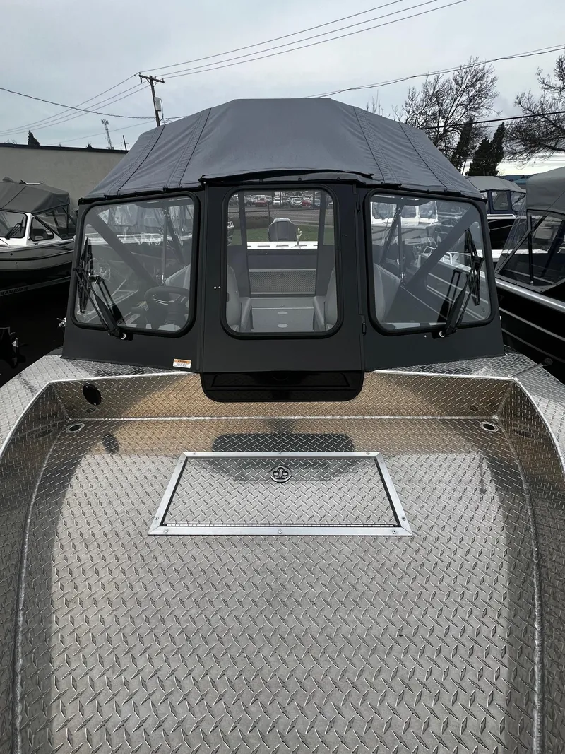 Slide: The Image of 2024 Thunder Jet 21 Chinook OS boat with diamond plate deck and enclosed cabin. - 8