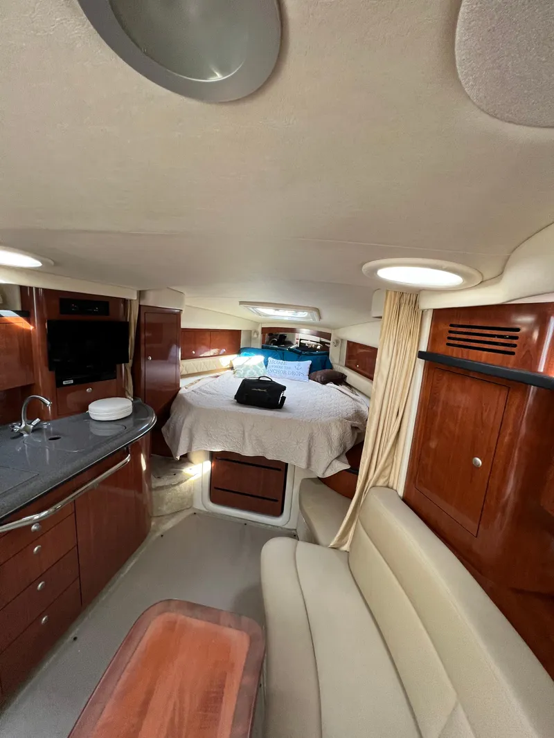 Slide: The Image of Luxurious interior of 2006 Sea Ray 340 Sundancer yacht with cozy cabin and modern amenities. - 12