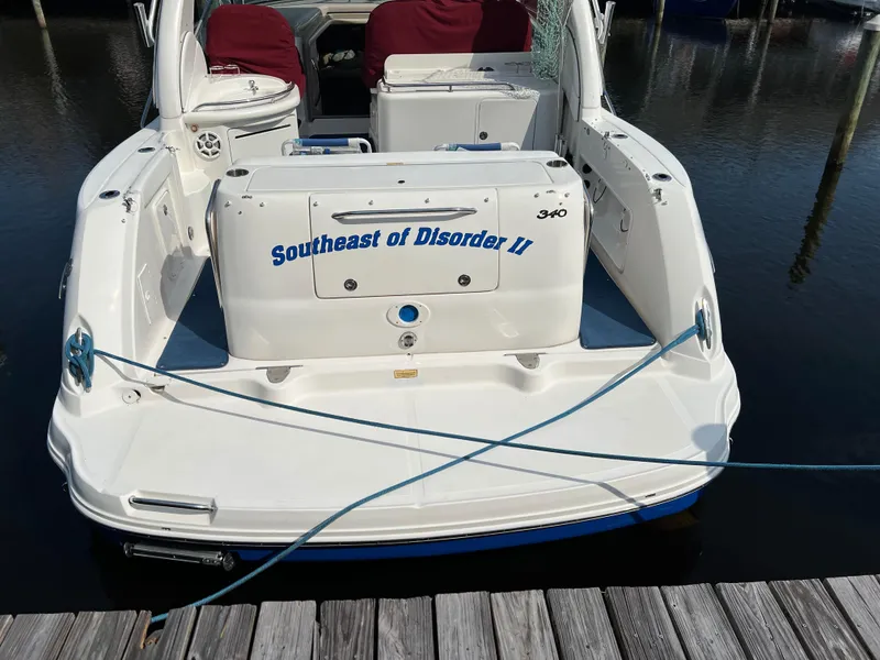 Slide: The Image of 2006 Sea Ray 340 Sundancer boat docked, named "Southeast of Disorder II". - 4