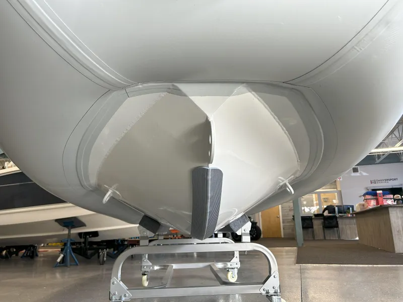 Slide: The Image of 2024 Highfield Classic 360 boat hull in showroom. - 10