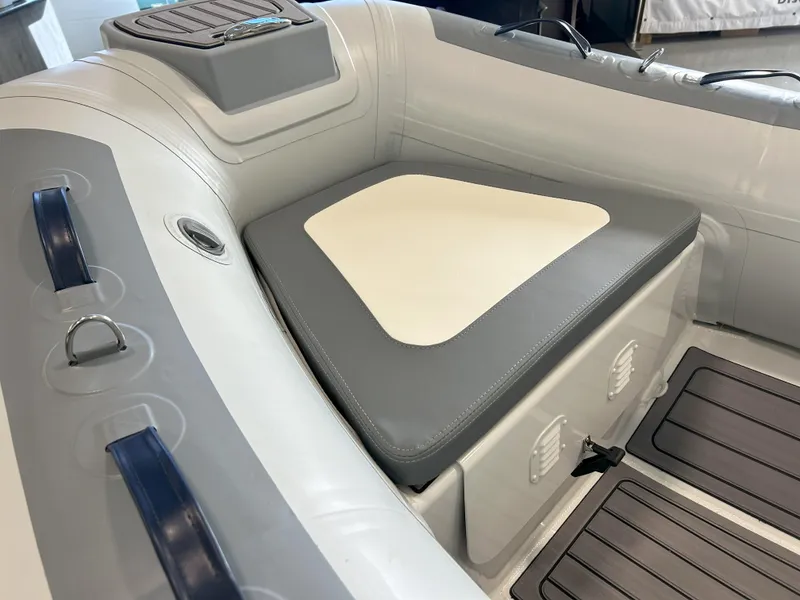 Slide: The Image of 2024 Highfield Classic 360 inflatable boat interior with cushioned seating and storage. - 3