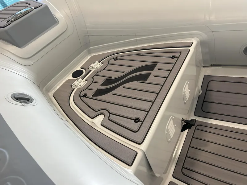 Slide: The Image of 2024 Highfield Classic 360 boat interior with storage compartments and non-slip flooring. - 4