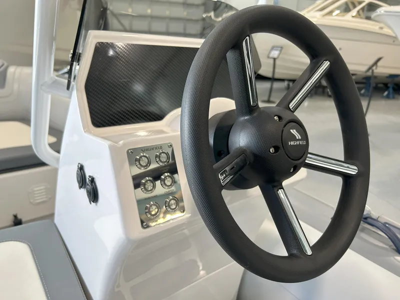 Slide: The Image of 2024 Highfield Classic 360 boat steering console and dashboard. - 9